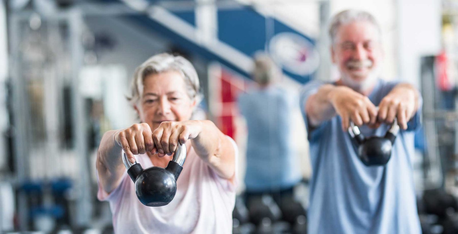 Two older people working out